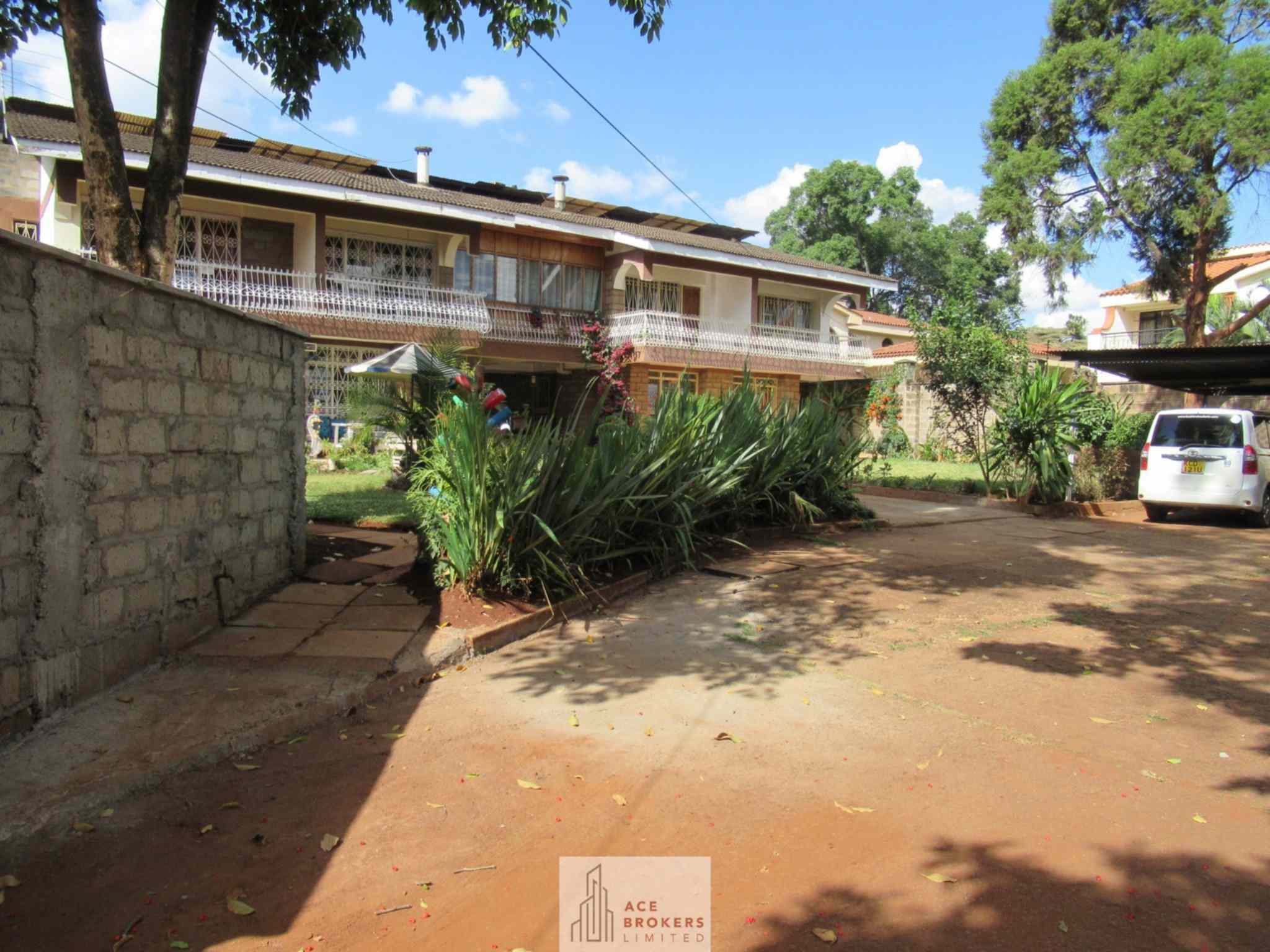 0.45 acre plot with house for sale along Lower Kabete road